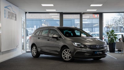 Opel Astra 1,0 T 105 Enjoy Sports Tourer Benzin modelår 2018 km 83900 Grå træk nysynet ABS airbag al