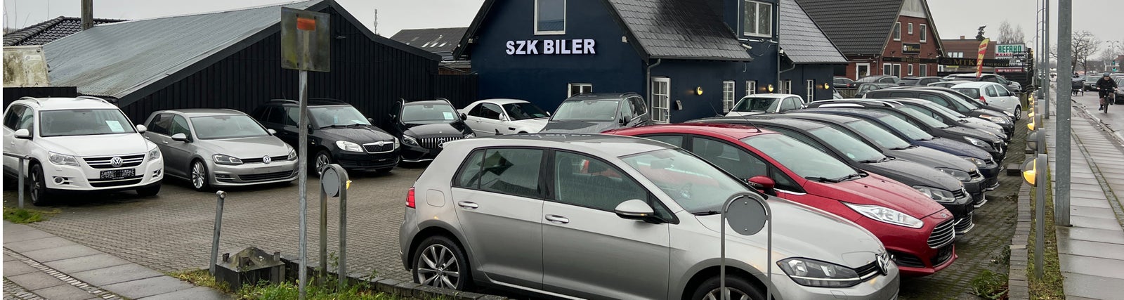 SZK Biler Aps logo